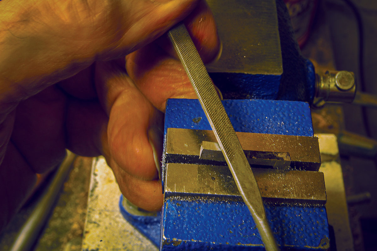 Shape the extractor using a felt tip pen to mark where to remove metal. This also illustrates the value of using a small vise in gun work.